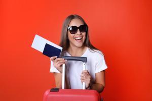 Woman with a suitcase and travel insurance in Ireland